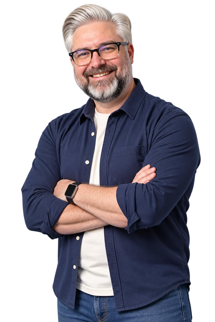 Jeremy Kenerson smiling with his arms crossed